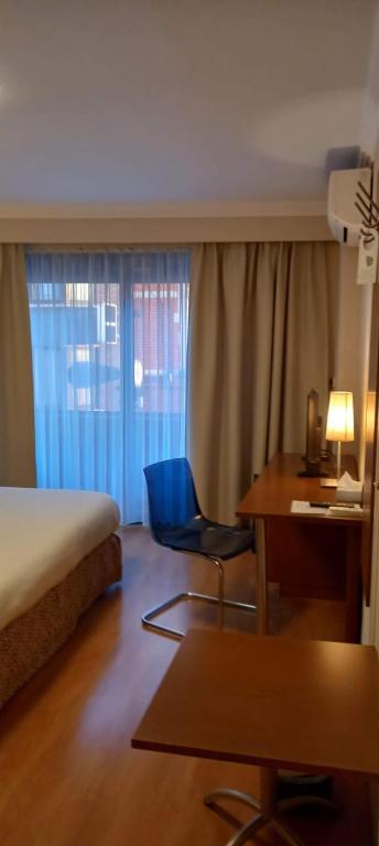 Postel nebo postele na pokoji v ubytování Hotel De Croone