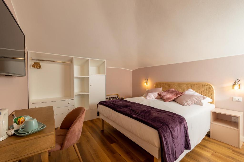 Łóżko lub łóżka w pokoju w obiekcie B&B Follonica
