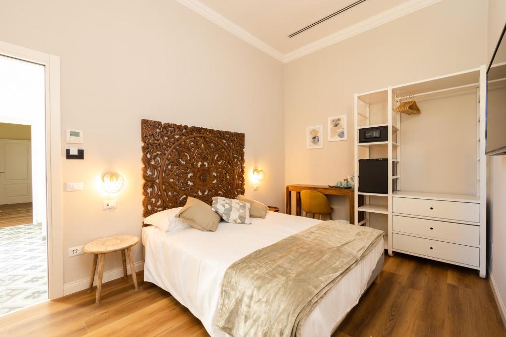 Łóżko lub łóżka w pokoju w obiekcie B&B Follonica