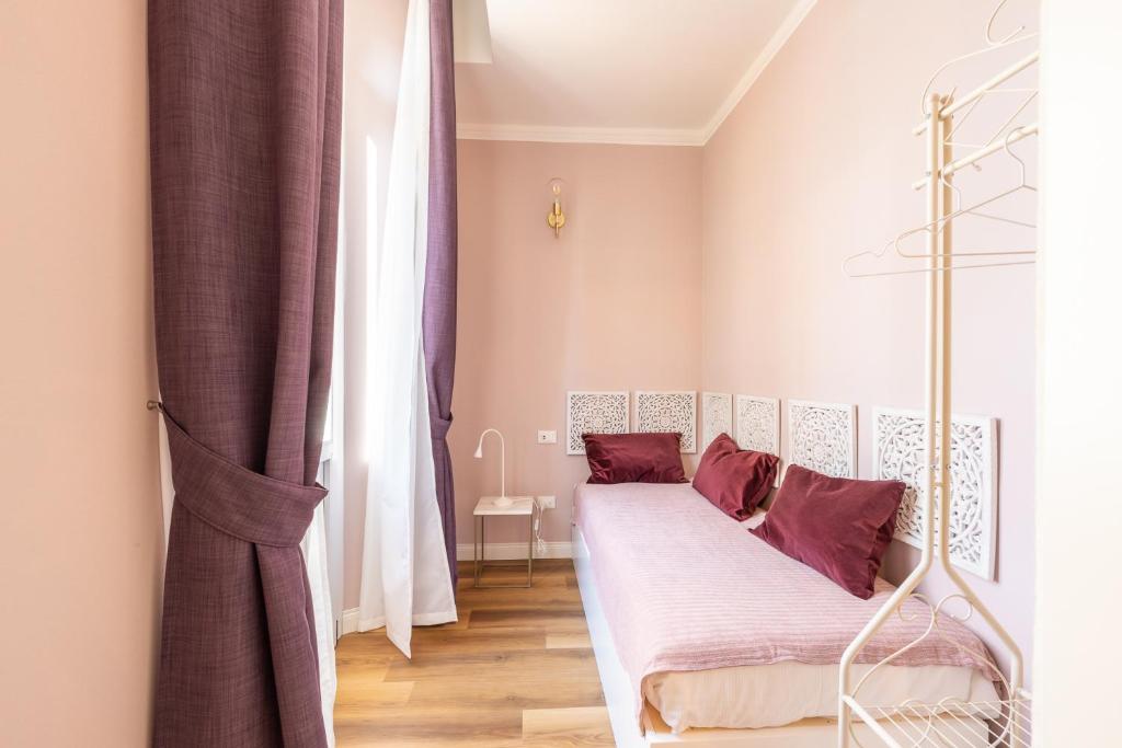 Łóżko lub łóżka w pokoju w obiekcie B&B Follonica