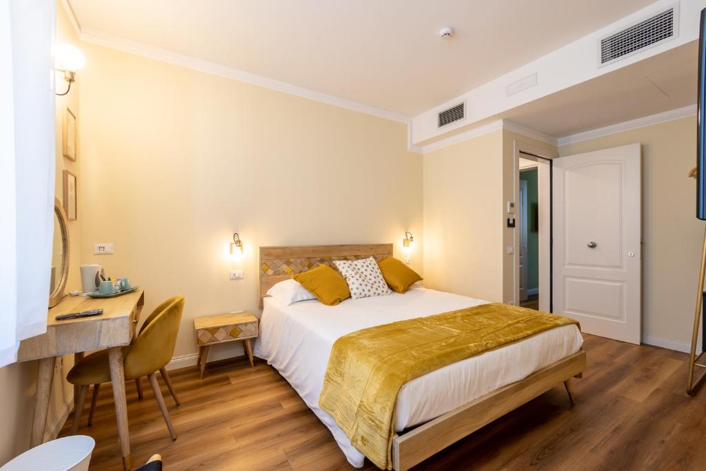 Łóżko lub łóżka w pokoju w obiekcie B&B Follonica