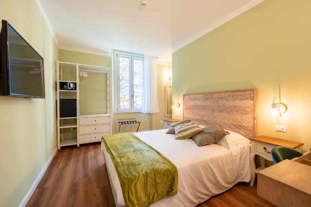 Łóżko lub łóżka w pokoju w obiekcie B&B Follonica