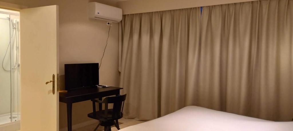 TV a/nebo společenská místnost v ubytování Hotel De Croone