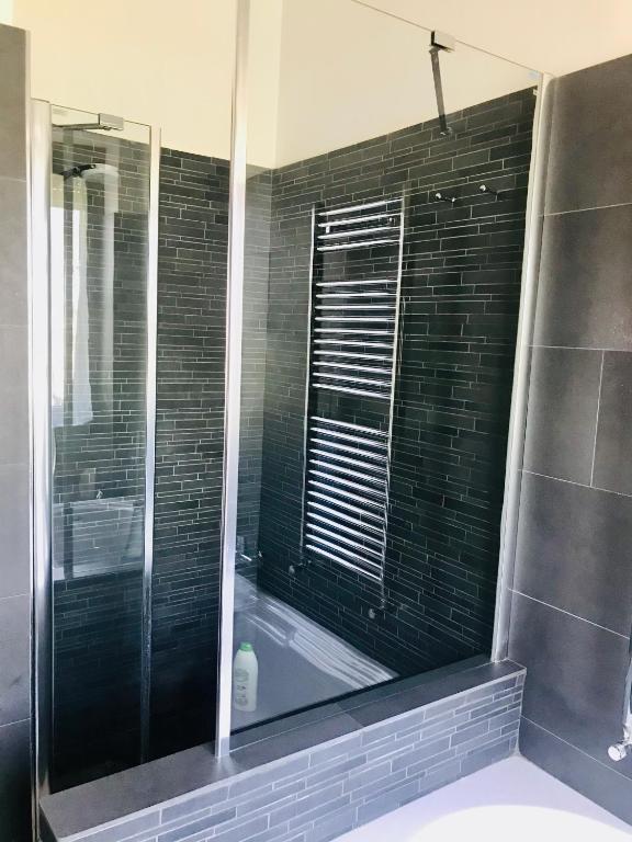a bathroom with a bath tub and a window at Carolina’S Nest in Casal Palocco