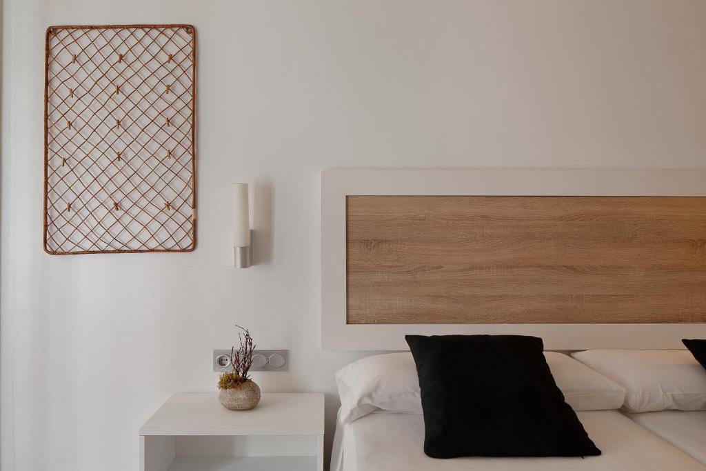 a living room with a white couch and a table at Hotel Santa Rosa, Blue Hoteles in Gijón