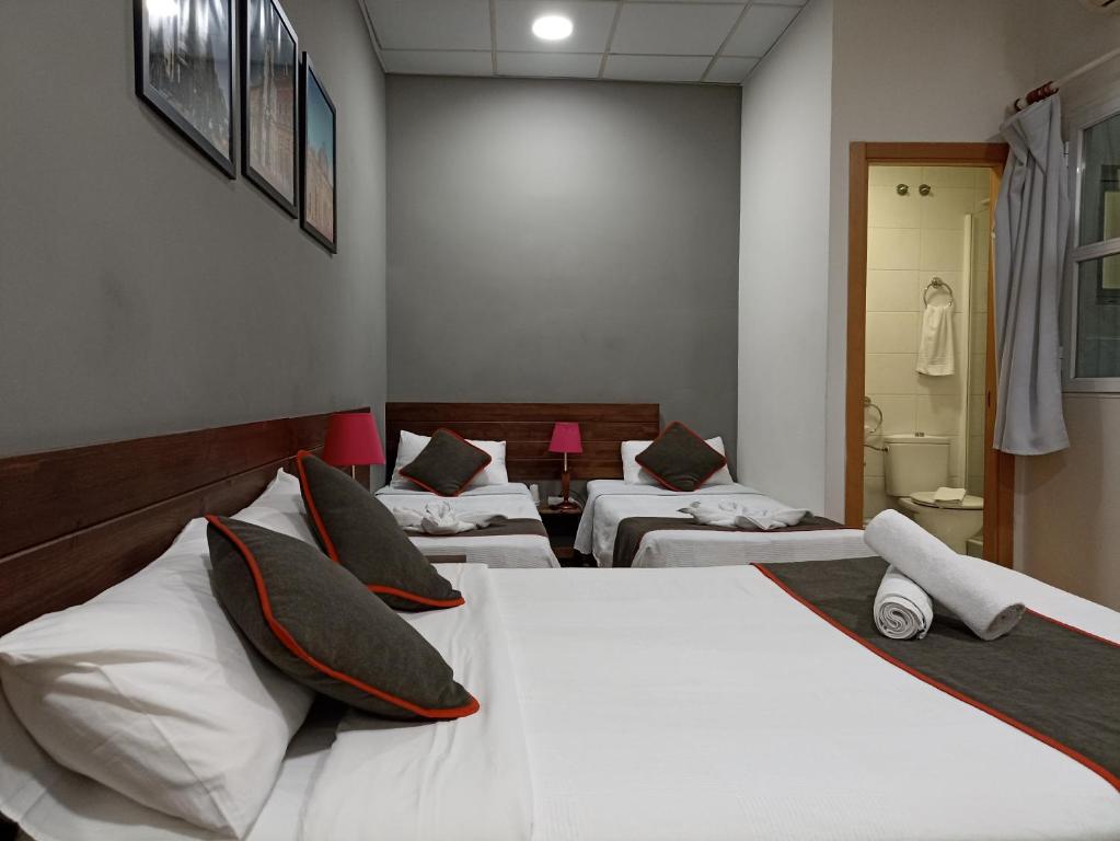 Ένα ή περισσότερα κρεβάτια σε δωμάτιο στο CH Murallas II