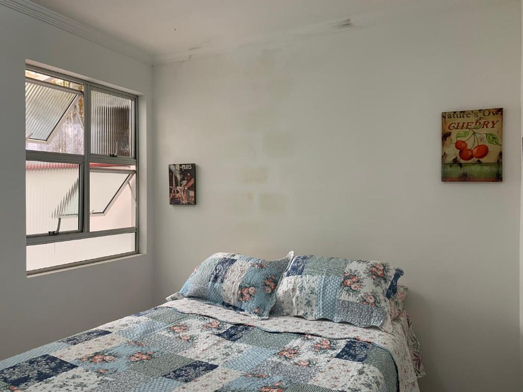 سرير أو أسرّة في غرفة في Canto do Gerrmano - Casa Compartilhada