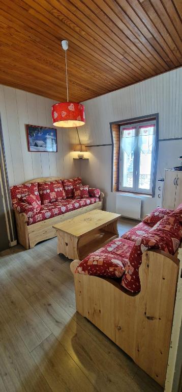 a room with couches and tables in a building at "Le 5" RÉSIDENCE BROUSSE in Le Mont-Dore