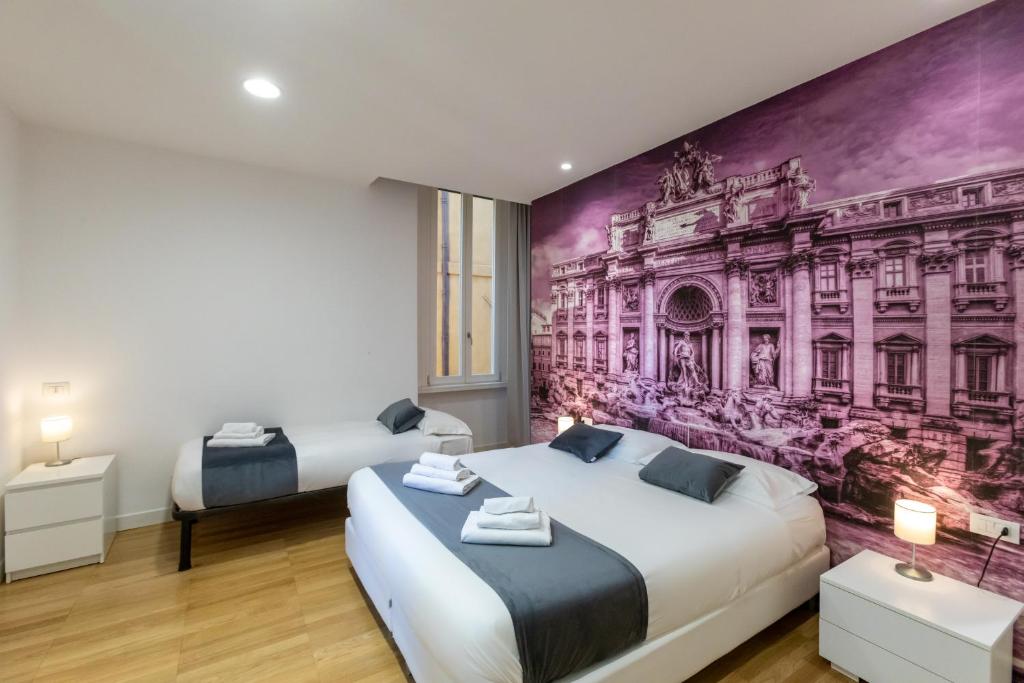Łóżko lub łóżka w pokoju w obiekcie Trevi Elite Rome