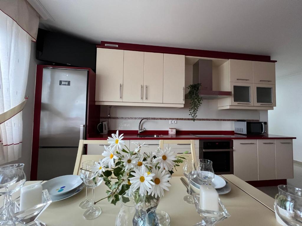 Kuchyň nebo kuchyňský kout v ubytování Apartamentos María de Lucía - Piso B