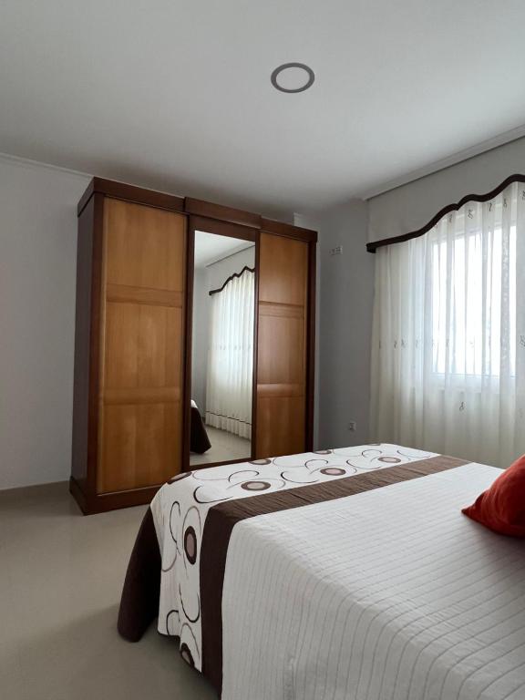 Postel nebo postele na pokoji v ubytování Apartamentos María de Lucía - Piso B