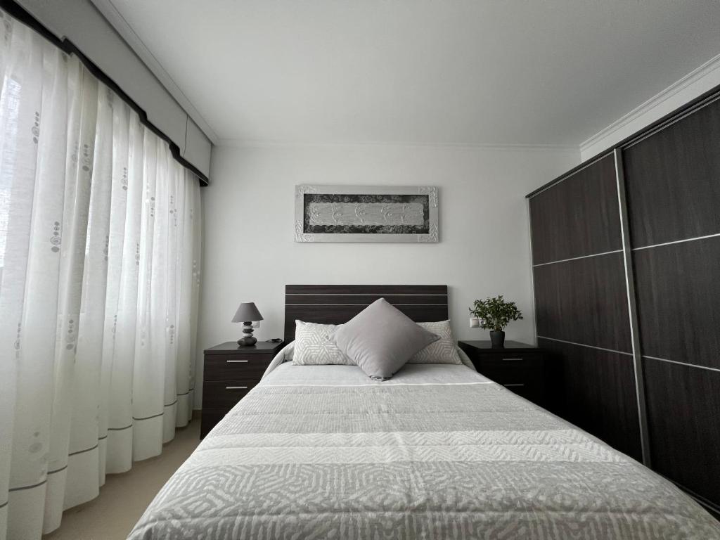 Postel nebo postele na pokoji v ubytování Apartamentos María de Lucía - Piso B