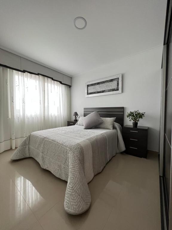 Postel nebo postele na pokoji v ubytování Apartamentos María de Lucía - Piso B