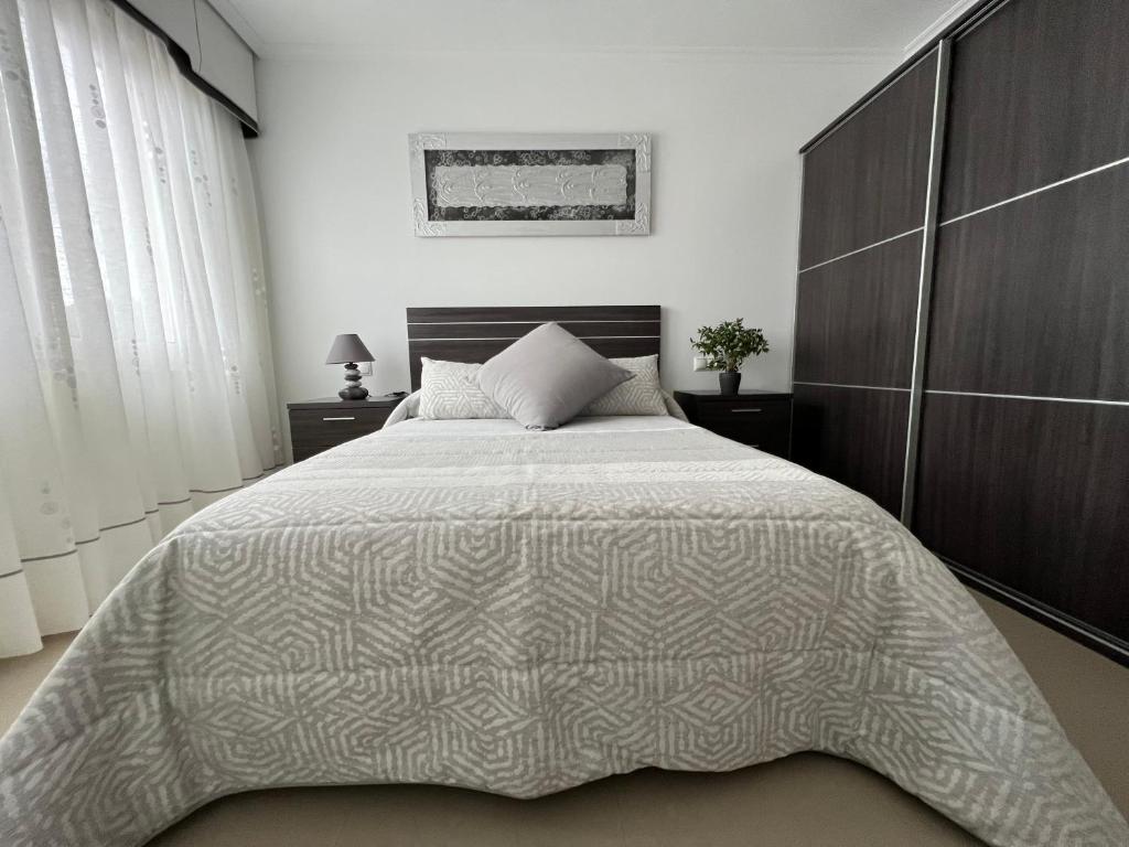 Postel nebo postele na pokoji v ubytování Apartamentos María de Lucía - Piso B