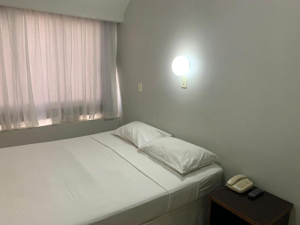 Postel nebo postele na pokoji v ubytování Hotel Doral Apucarana
