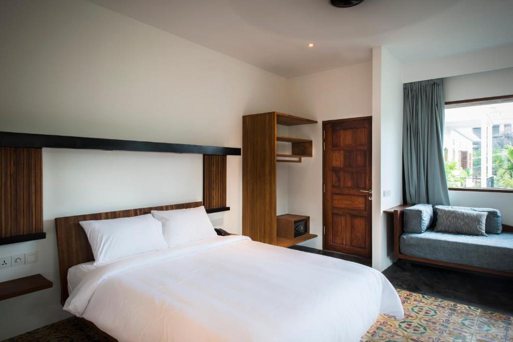 Postel nebo postele na pokoji v ubytování Pages Rooms Hotel
