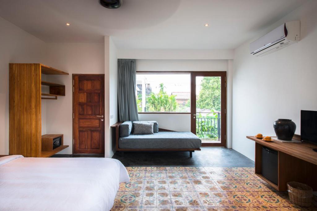 Postel nebo postele na pokoji v ubytování Pages Rooms Hotel