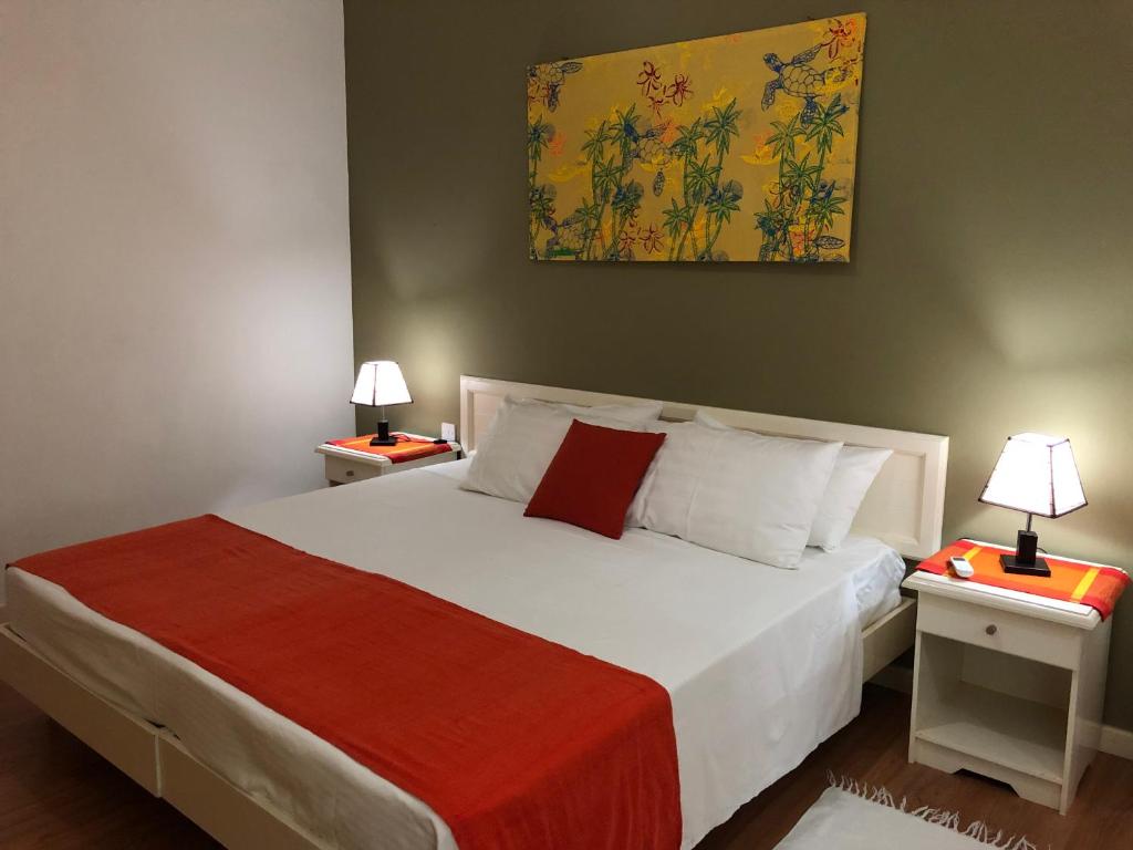 Postel nebo postele na pokoji v ubytování Sunbird Bungalow