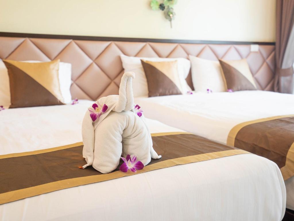 Postel nebo postele na pokoji v ubytování Baan Sailom Hotel Phuket - Sha Extra Plus