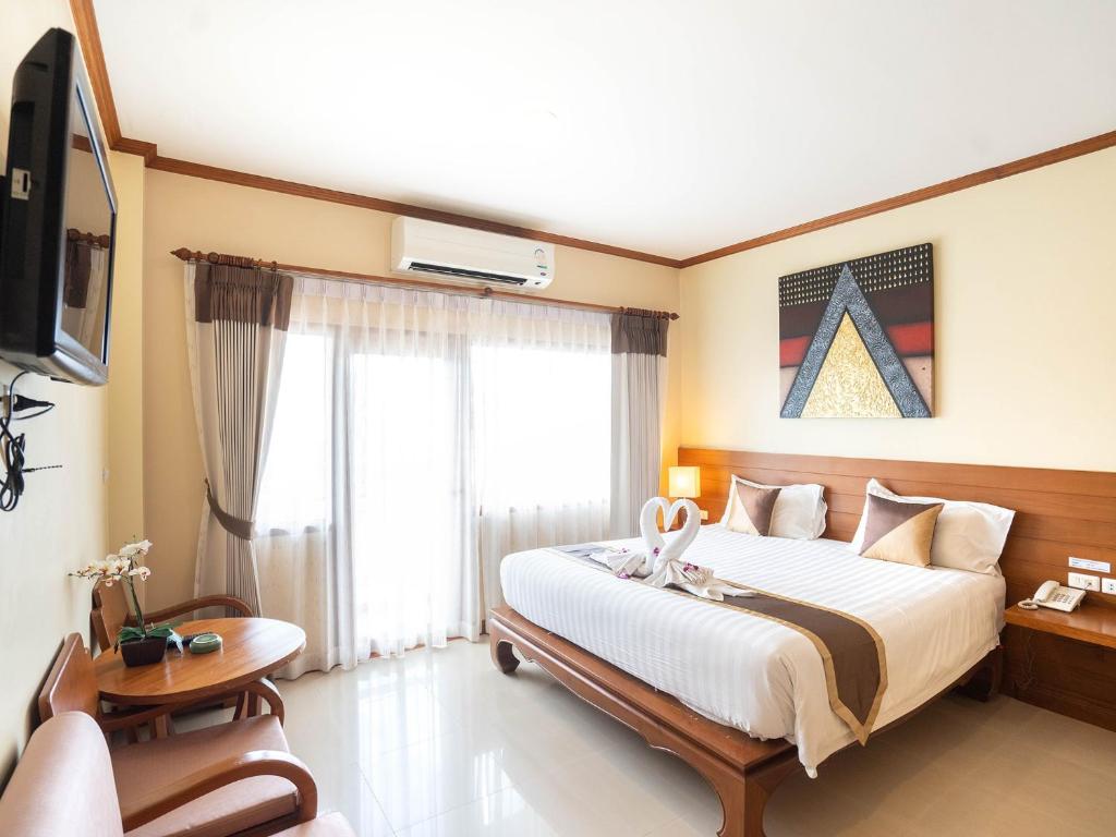 Postel nebo postele na pokoji v ubytování Baan Sailom Hotel Phuket - Sha Extra Plus