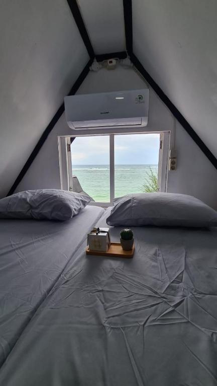 Postel nebo postele na pokoji v ubytování Saho Coffee & Rooms