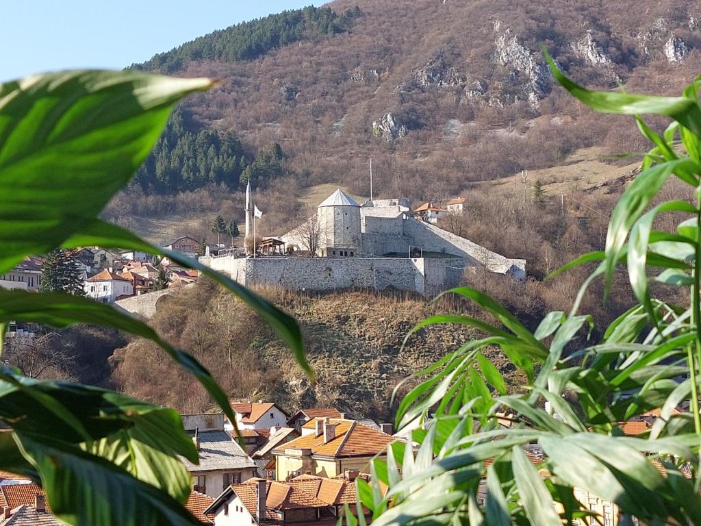 a town on a hill with a castle on it at Panorama Travnik in Travnik