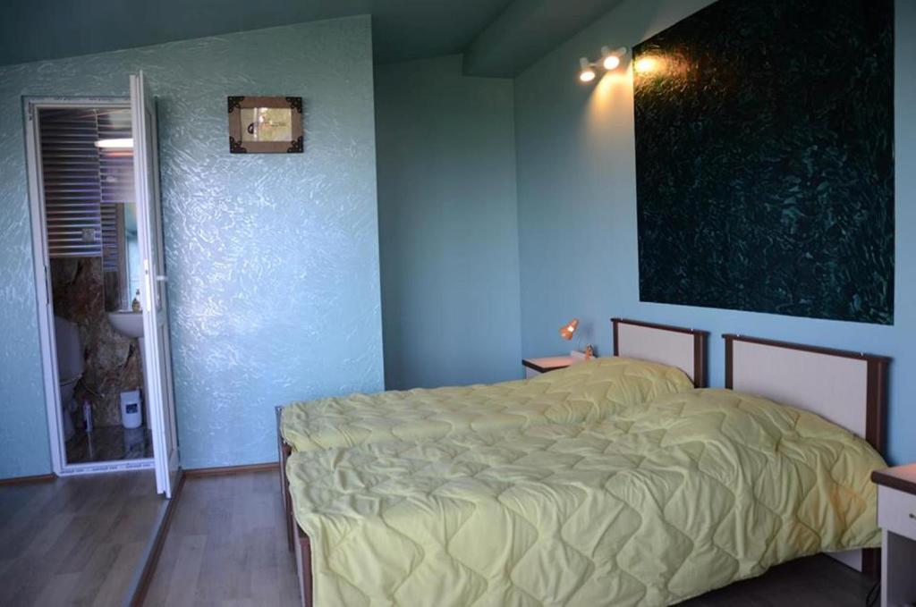 Postel nebo postele na pokoji v ubytování TJ Guest House