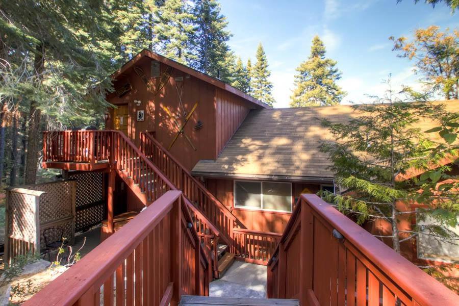 a home with a staircase leading up to a house at Alpine View in Yosemite West