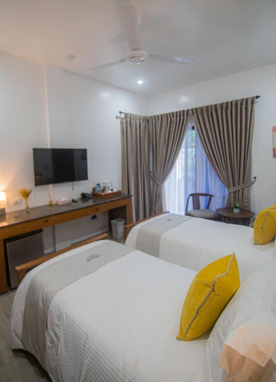 Postel nebo postele na pokoji v ubytování Thistle Inn
