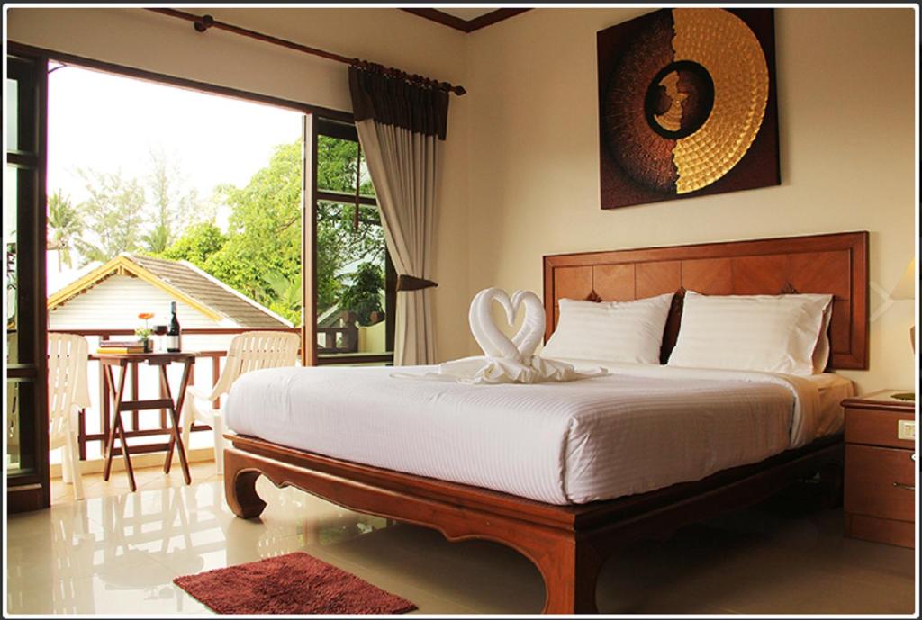 Postel nebo postele na pokoji v ubytování Baan Sailom Hotel Phuket - Sha Extra Plus