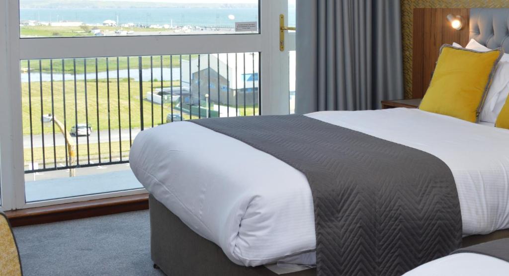 Postel nebo postele na pokoji v ubytování Majestic Hotel