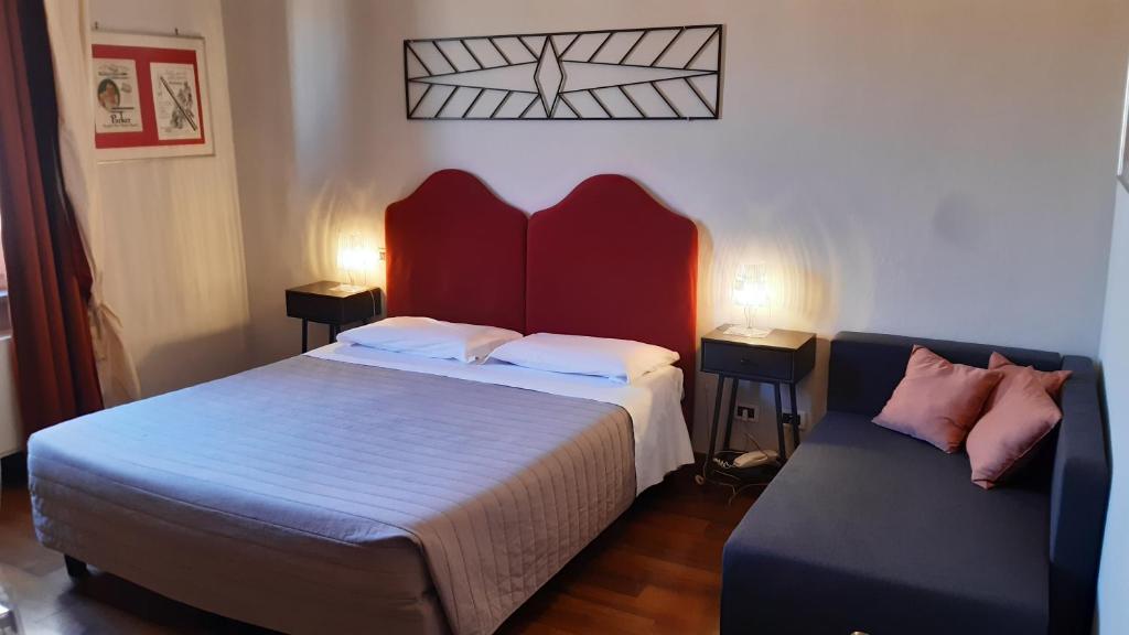 Postel nebo postele na pokoji v ubytování Albergo Moderno