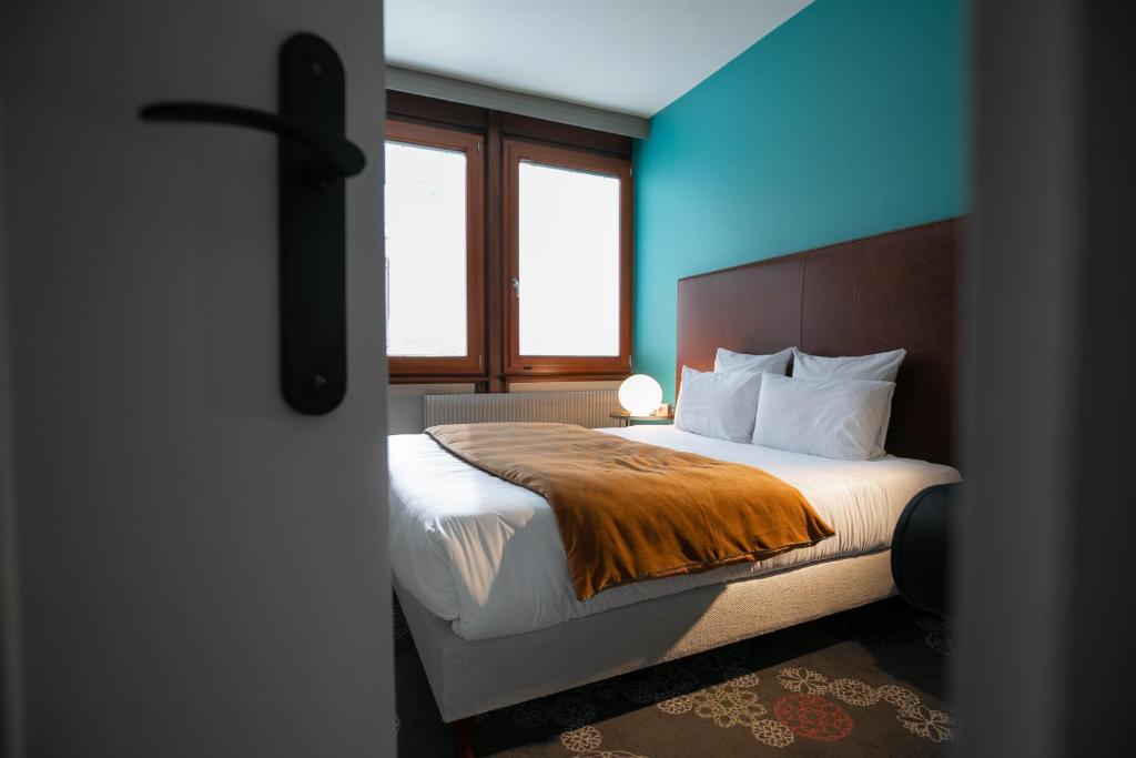 Postel nebo postele na pokoji v ubytování Hôtel Restaurant Vaillant proche Europapark Rulantica