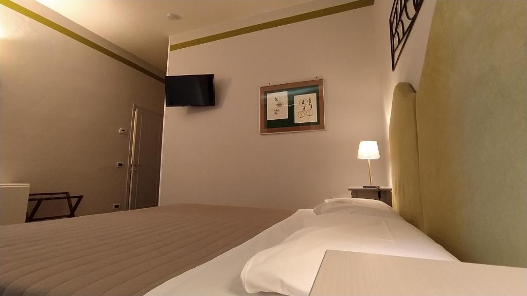Postel nebo postele na pokoji v ubytování Albergo Moderno