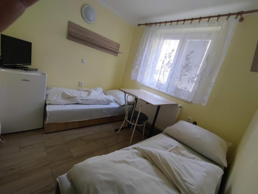 A bed or beds in a room at Rekreačné zariadenie Javorinka