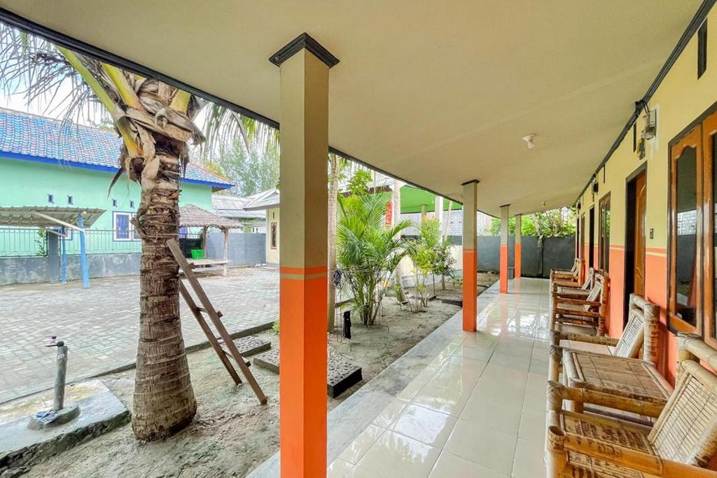 Zahrada ubytování Ekas Beach Guesthouse Mitra RedDoorz