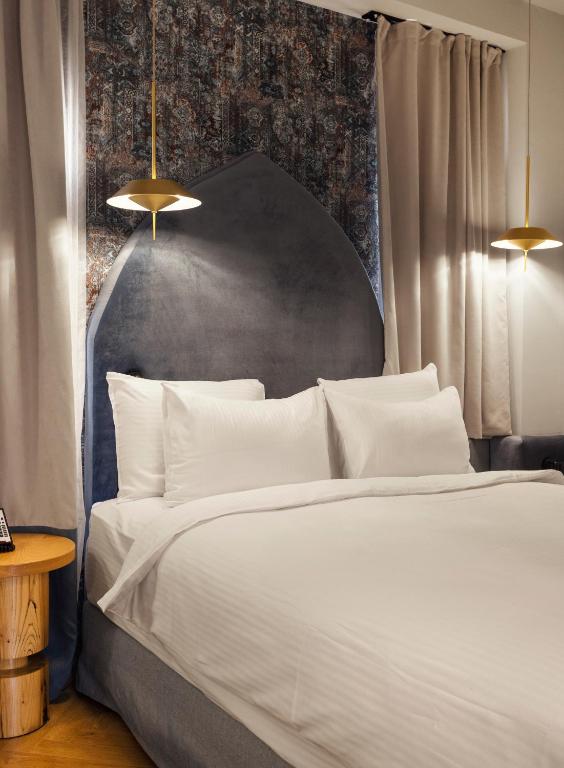 Postel nebo postele na pokoji v ubytování Abanotubani Boutique hotel