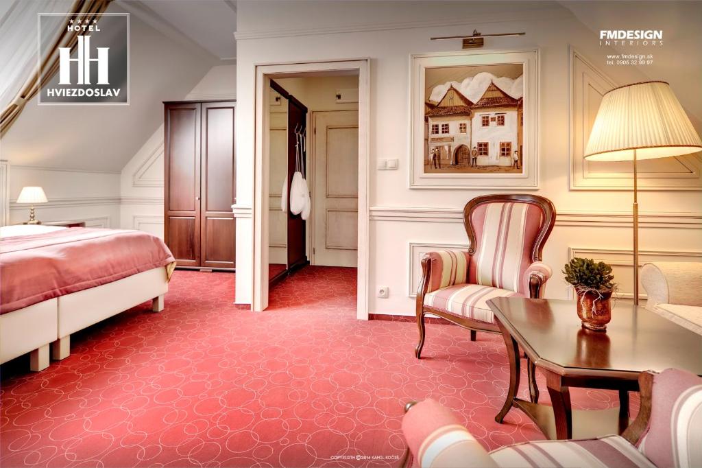 Postel nebo postele na pokoji v ubytování Boutique Hotel Hviezdoslav