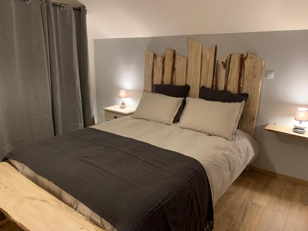 Ένα ή περισσότερα κρεβάτια σε δωμάτιο στο Le Millésime