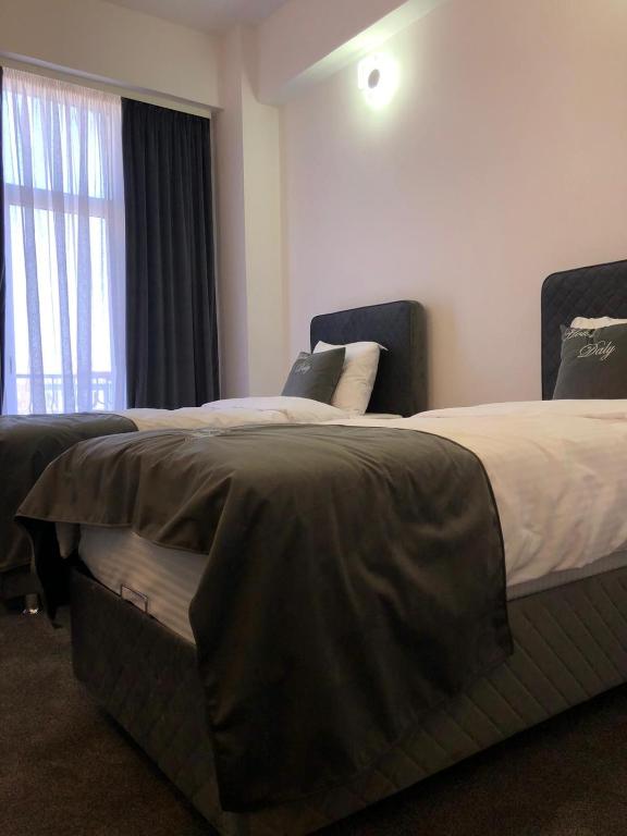 Postel nebo postele na pokoji v ubytování Hotel Daly