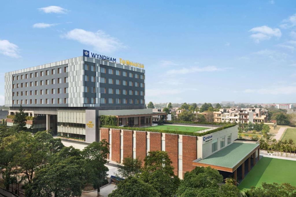 a rendering of a building with a hospital at Wyndham Chandigarh Mohali in Chandīgarh
