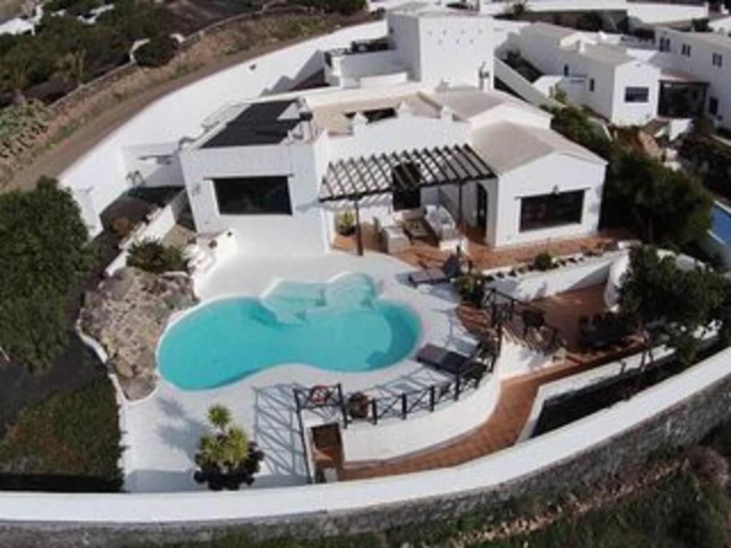 an aerial view of a house with a swimming pool at Villa Papaz - cosy spacious sea view pool in Conil