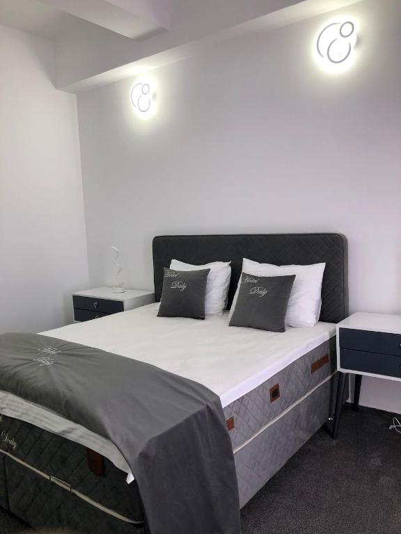Postel nebo postele na pokoji v ubytování Hotel Daly