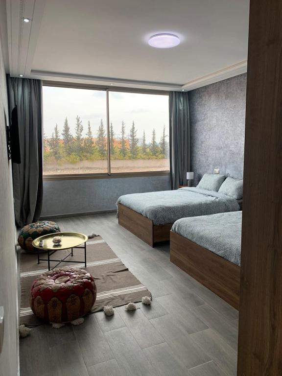 Postel nebo postele na pokoji v ubytování Riad L'Aéroport