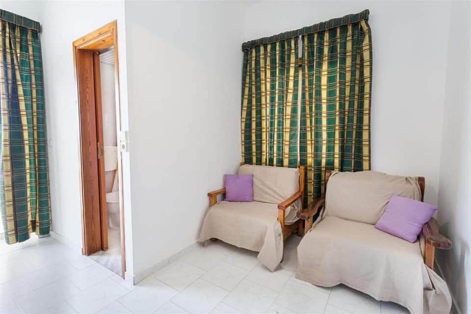 A bed or beds in a room at Michalis Litinas Apartments