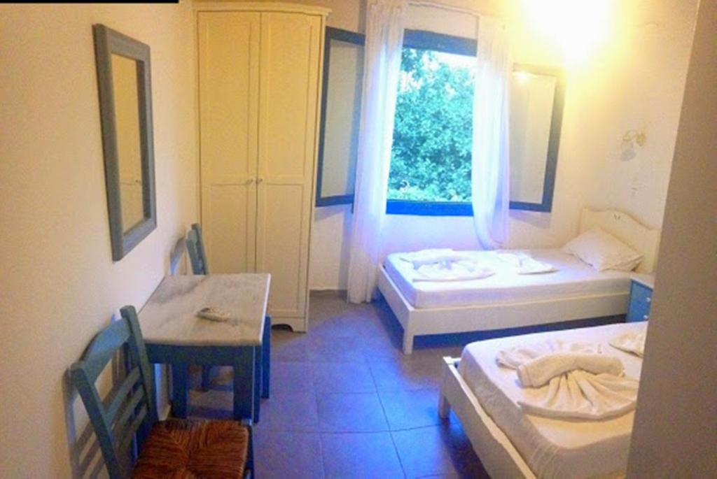 Postel nebo postele na pokoji v ubytování Sofia Rooms