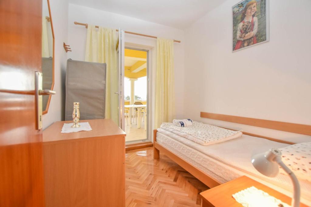 Posteľ alebo postele v izbe v ubytovaní Apartments Dandelion