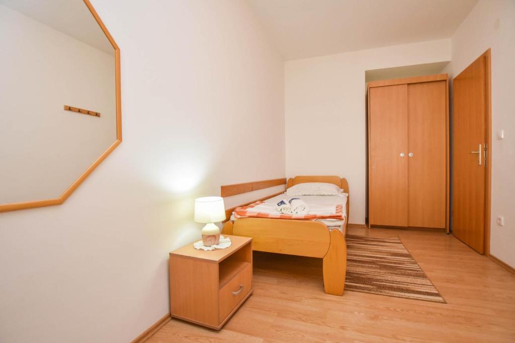 Posteľ alebo postele v izbe v ubytovaní Apartments Dandelion
