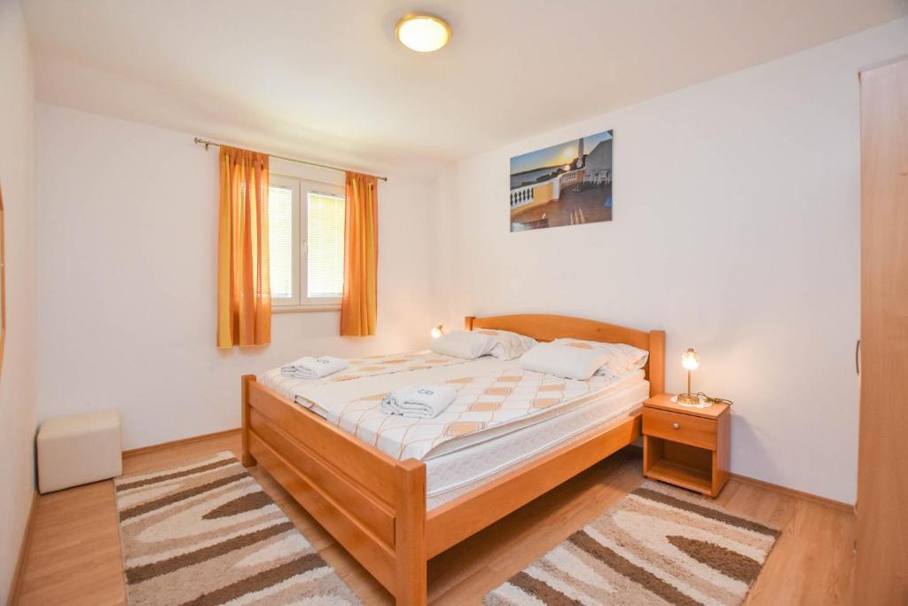 Posteľ alebo postele v izbe v ubytovaní Apartments Dandelion