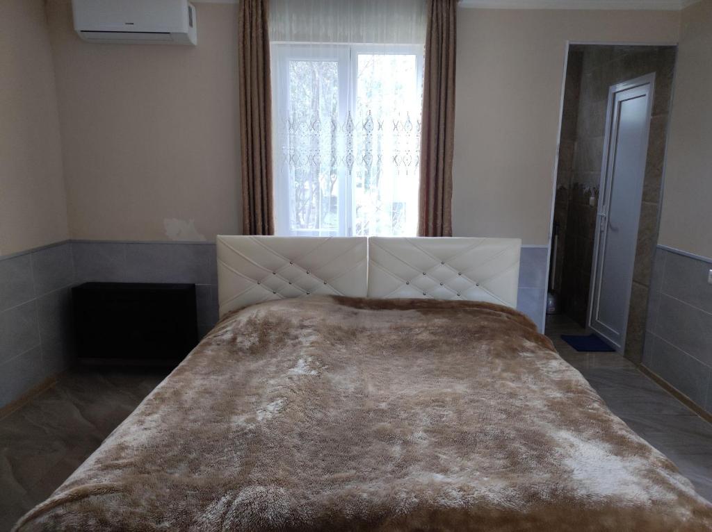 Postel nebo postele na pokoji v ubytování Guest House Koba